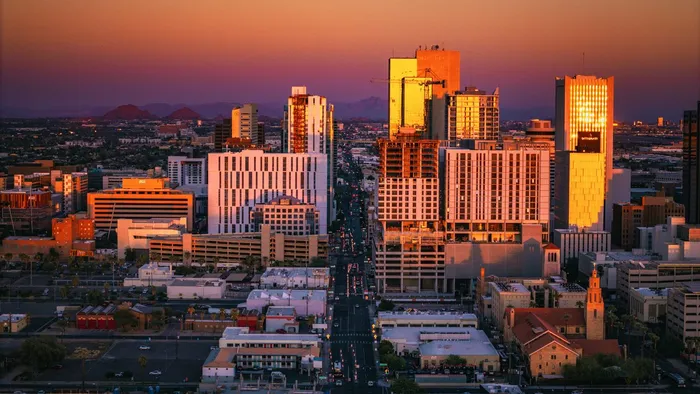 Downtown Phoenix, Arizona at sunset, with office towers glowing above the city grid