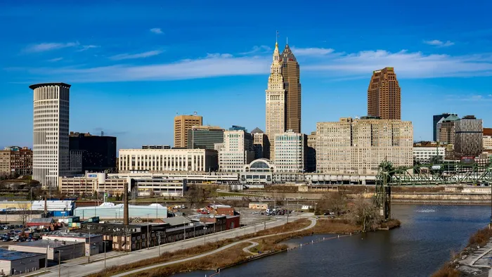 The downtown Cleveland, Ohio skyline above the Cuyahoga River on a clear day