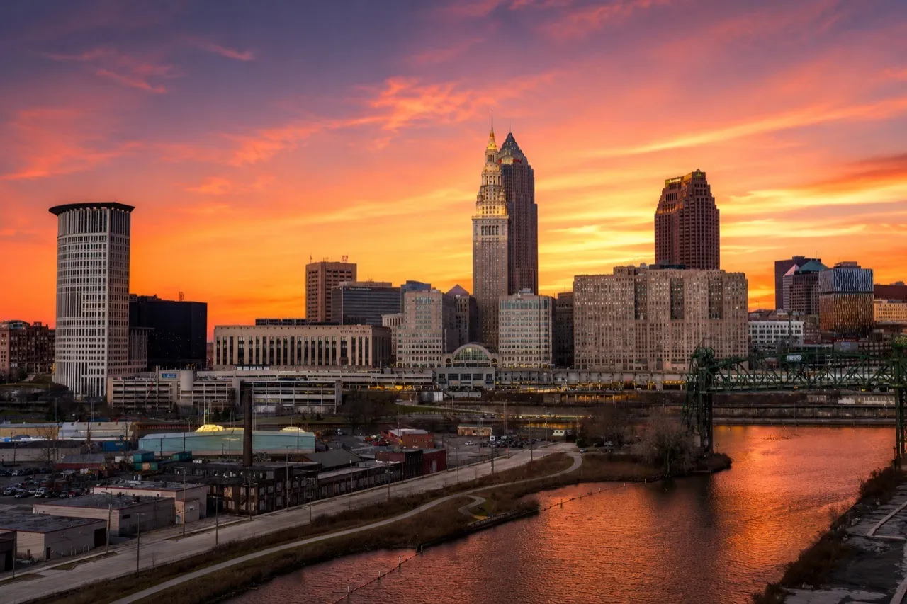 The downtown Cleveland, Ohio skyline at sunset over the Cuyahoga River