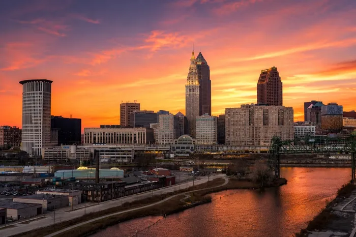 The downtown Cleveland, Ohio skyline at sunset over the Cuyahoga River
