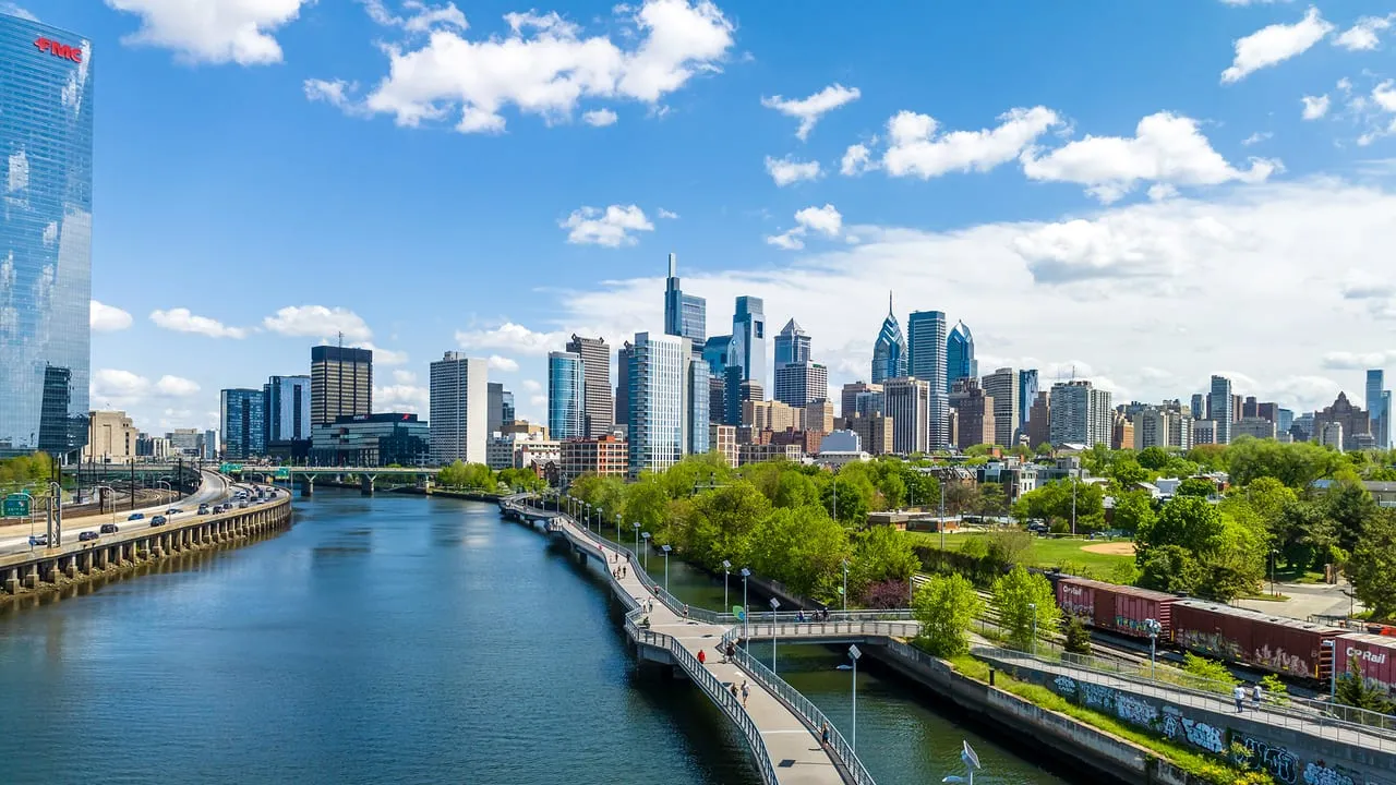 The Philadelphia skyline seen across the Schuylkill River from the Schuylkill Banks boardwalk