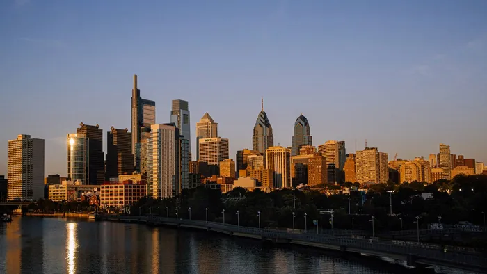 The Philadelphia skyline at golden hour seen across the Schuylkill River