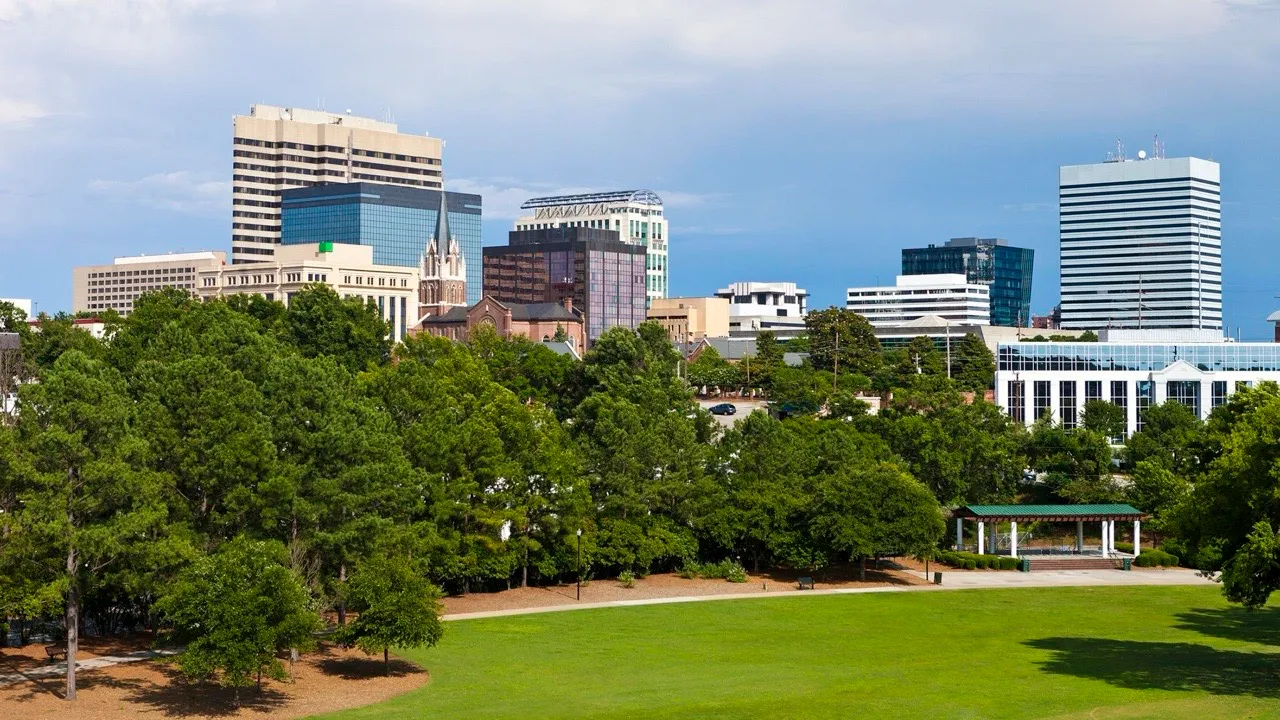 The downtown Columbia, South Carolina skyline seen across a city park