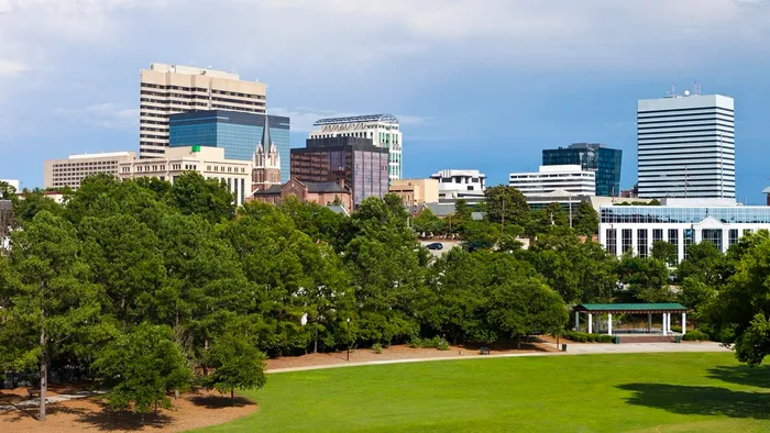 The downtown Columbia, South Carolina skyline seen across a city park